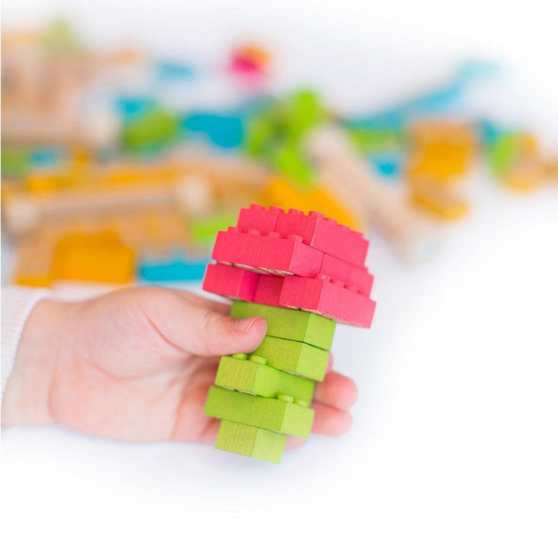 Once Kids Eco-Bricks™ Color made with water based color and biodegradable wooden construction blocks. The Eco-Bricks™ Color 54-piece set is made from Non-Toxic Water-Base Color, a brilliant first step into healthier, greener, construction block fun! Building Construction toy